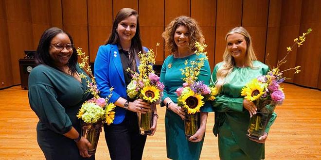 The 2022 Woman of the Year winners pose with their flowers.