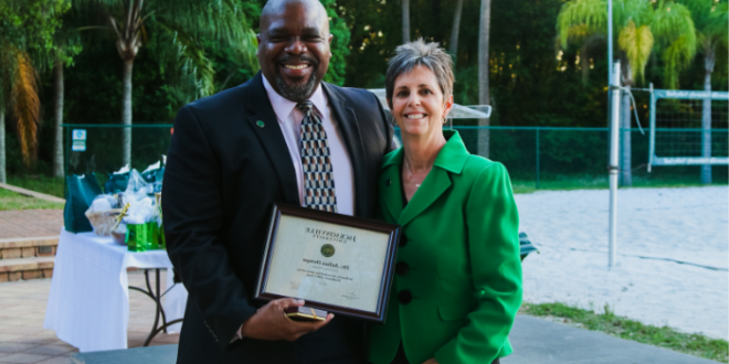 Dr. Demps (right) is recognized with the 2022-2023 Professor of the Year award. Photo by Taylor Sloan.