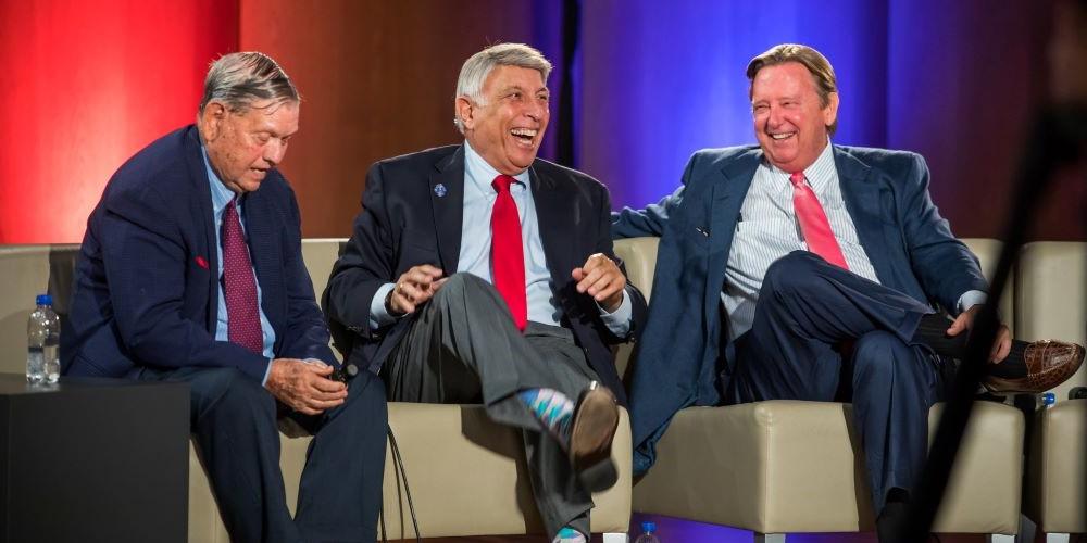 left to right: former mayors John Delaney, Tommy Hazouri, and Jake Godbold laughing on stage